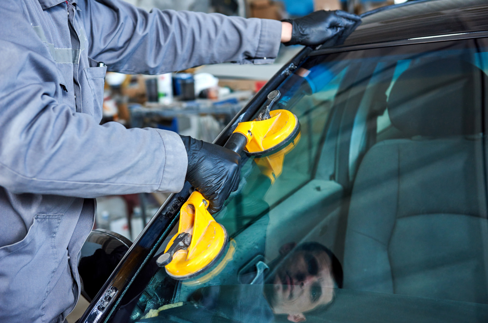 Technician working on windshield